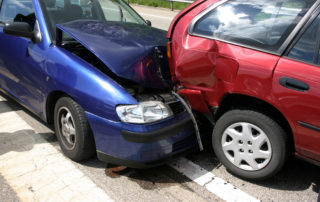 blue car fender bender a red car in Tennessee - What Tennessee Drivers Need to Know about Fault Laws for Car Accidents